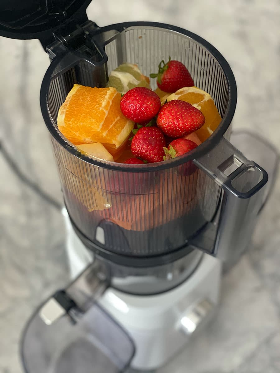 Nama J2 Cold Press Juicer with strawberries